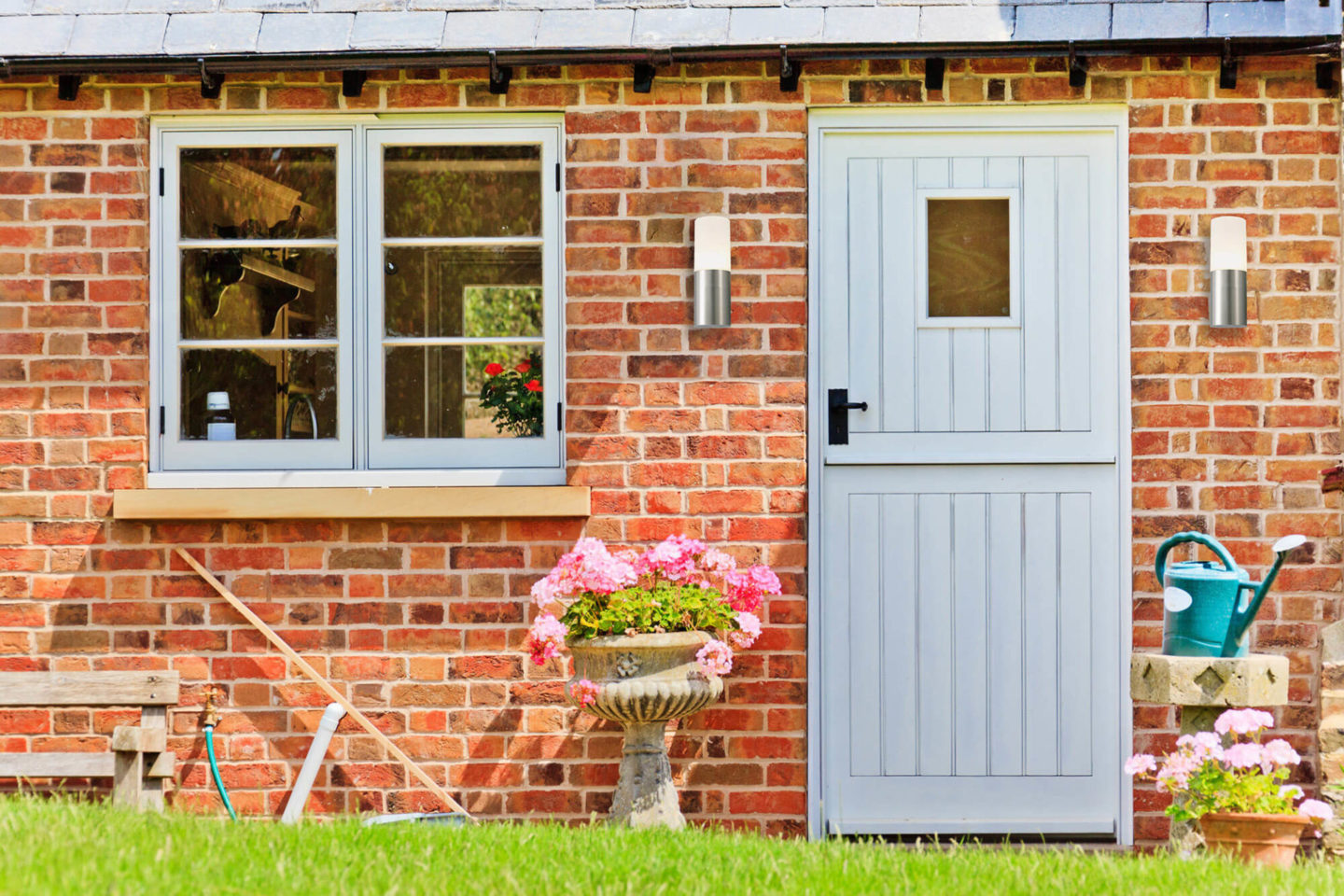 blue stable door installed on brick home